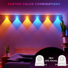 LED string downlights with white heads and multicolor glow over a bedroom wall