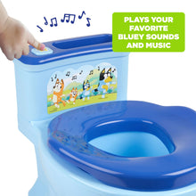 Light blue potty trainer with blue top seat and illustrated front panel with music icons