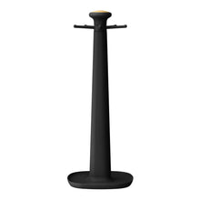 Black rotating utensil rack with gold accents and slots for silicone tools