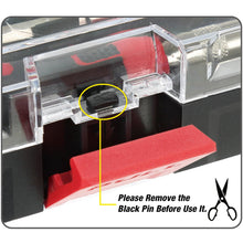 Black plastic pin accessory inside clear compartment of precision tool kit case