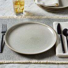 Cream ceramic dinner plate, speckled finish with tan edge