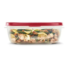 Clear plastic food container with red lid filled with prepared meal