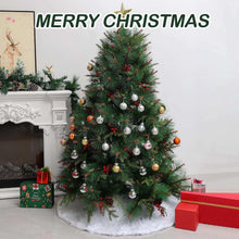 White plush tree skirt under decorated Christmas tree