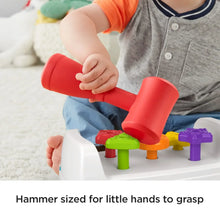 Tap and turn bench toy with colorful shape pegs and red hammer