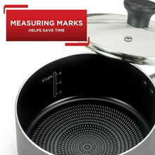 Interior of grey nonstick saucepan with cup measuring marks