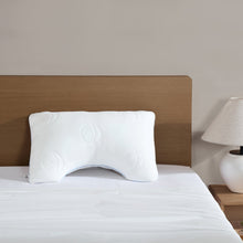 White cooling pillow with embossed circular pattern and U-shaped cutout for airflow