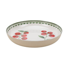 Tomato motif chip and dip serving bowl with green rim and shallow beige base
