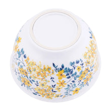 Blue and yellow floral melamine mixing bowl with cream-trimmed rim, white exterior