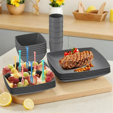 Gray square plates and cups set with stacked dishes and candles