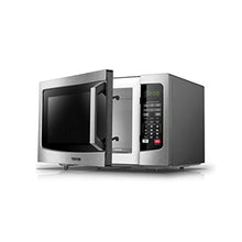 Stainless steel Toshiba countertop microwave oven with open door and visible interior cavity