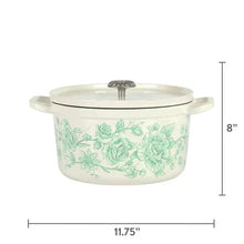 Green floral enameled cast iron Dutch oven with domed lid knob and side handles