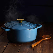 Blue enamel cast iron Dutch oven with lid and side handles
