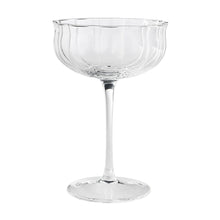 Clear scalloped cocktail glass with short stem and round base
