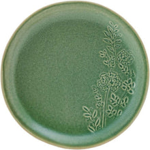Green stoneware plate with embossed floral-and-branch pattern around the rim