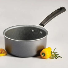 Open sauce pan with textured nonstick interior, black handle, steel gray body