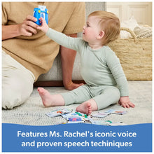 Toddler using a blue talking flash card reader toy with word cards