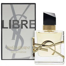 Libre Eau de Parfum spray bottle with gold cap and decorative gold strap, with box