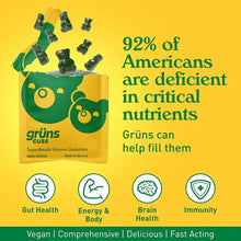 Grüns Cubes gummy pouch with scattered green bears and icons for gut, energy, brain, immunity