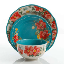 Floral bowl with teal interior and red flower design around the rim