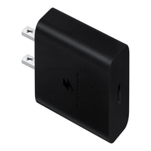 Wireless charger power adapter with two flat prongs, dark gray.