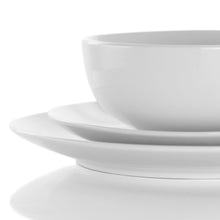 White porcelain dinner plate and bowl set, stacked for serving