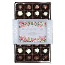Cheesecake truffles in a chocolate tray with mixed dark and white centers