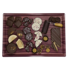 Assorted chocolate party tray with dark, white, and nut-covered pieces