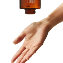 ACWELL licorice pH-balancing cleansing toner drop on hand with bottle nozzle
