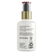 Serum bottle with gold pump top and red text on back label