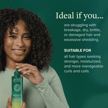Hair and scalp treatment bottle held by smiling woman with green label