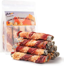 Chicken and duck wrapped cod skin dog treat sticks, shown stacked in a clear bag.
