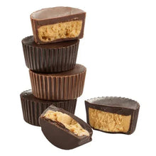 Chocolate peanut butter cups stack with broken cup pieces