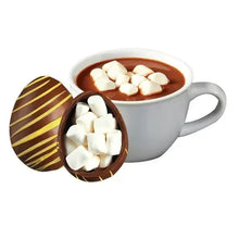 Hot chocolate mug with marshmallows and chocolate egg bomb halves