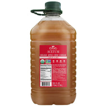 Organic apple cider vinegar bottle with dark green cap and Acetum label, 128 fl oz