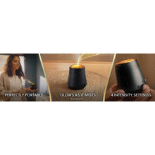 Portable cordless oil diffuser glowing amber, with multiple intensity settings shown