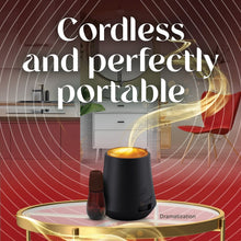 Cordless oil diffuser with glowing amber top and dark base on tray