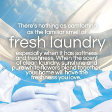 Scented oil air freshener with fresh linen scent, on white folded towels