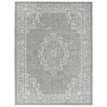 Gray square rug with central white medallion and ornate scrolling border