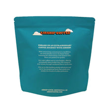 Whole bean coffee bag, teal back panel with coffee description and Airship logo