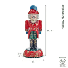 Nutcracker figurine with red coat, blue hat, teal pants, and red rounded base.