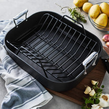 Black nonstick roaster pan with wire rack insert inside