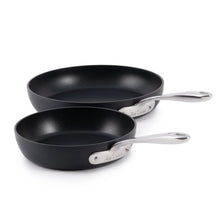 Nonstick skillet set with two black frying pans, silver handles and printed bases