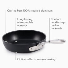 Black nonstick aluminum grill pan with silver handle and metal nameplate