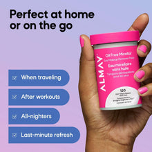 Micellar eye makeup remover pads jar held in hand, pink cap and pink label