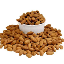 Pile of whole almonds in white bowl