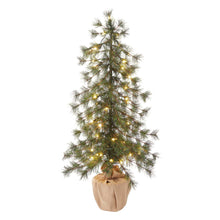 Artificial pine tree with bright warm LED lights and dense needles, beige fabric pot