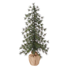 Artificial pine tree with warm LED lights and spreading branches, beige fabric pot