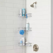 Gray corner tension pole caddy with multiple adjustable shelves in a shower corner