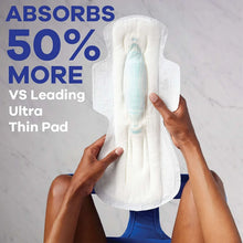White maxi overnight pad with wings, held upright with long center absorbent strip