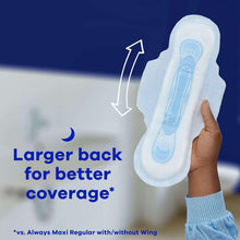 White maxi overnight pad with wings, held in hand with extra back coverage